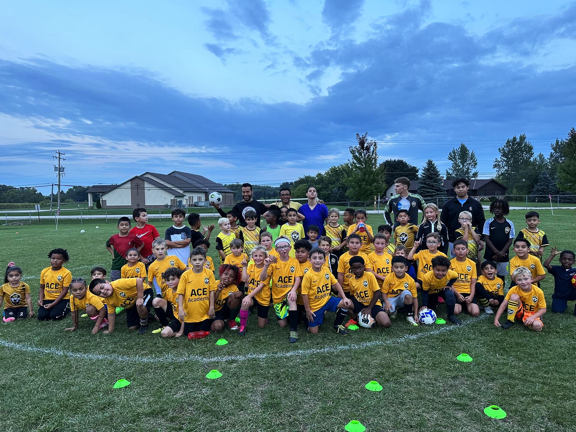 ACE Academy group photo at dusk training session at Franksville Park