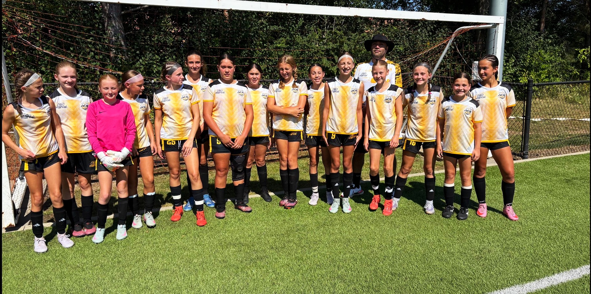 ACE Girls team lined up in front of the goal at Battle on the Border